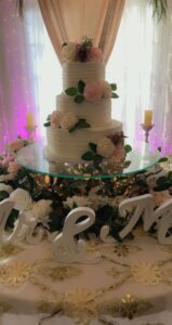 three tier wedding cake with pink roses
