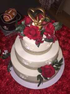 wedding cake with red roses