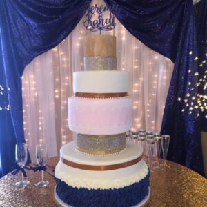 large wedding cake with blue and pink details